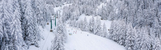 aerial-shot-skiing-track-snowy-landscape-sunlight